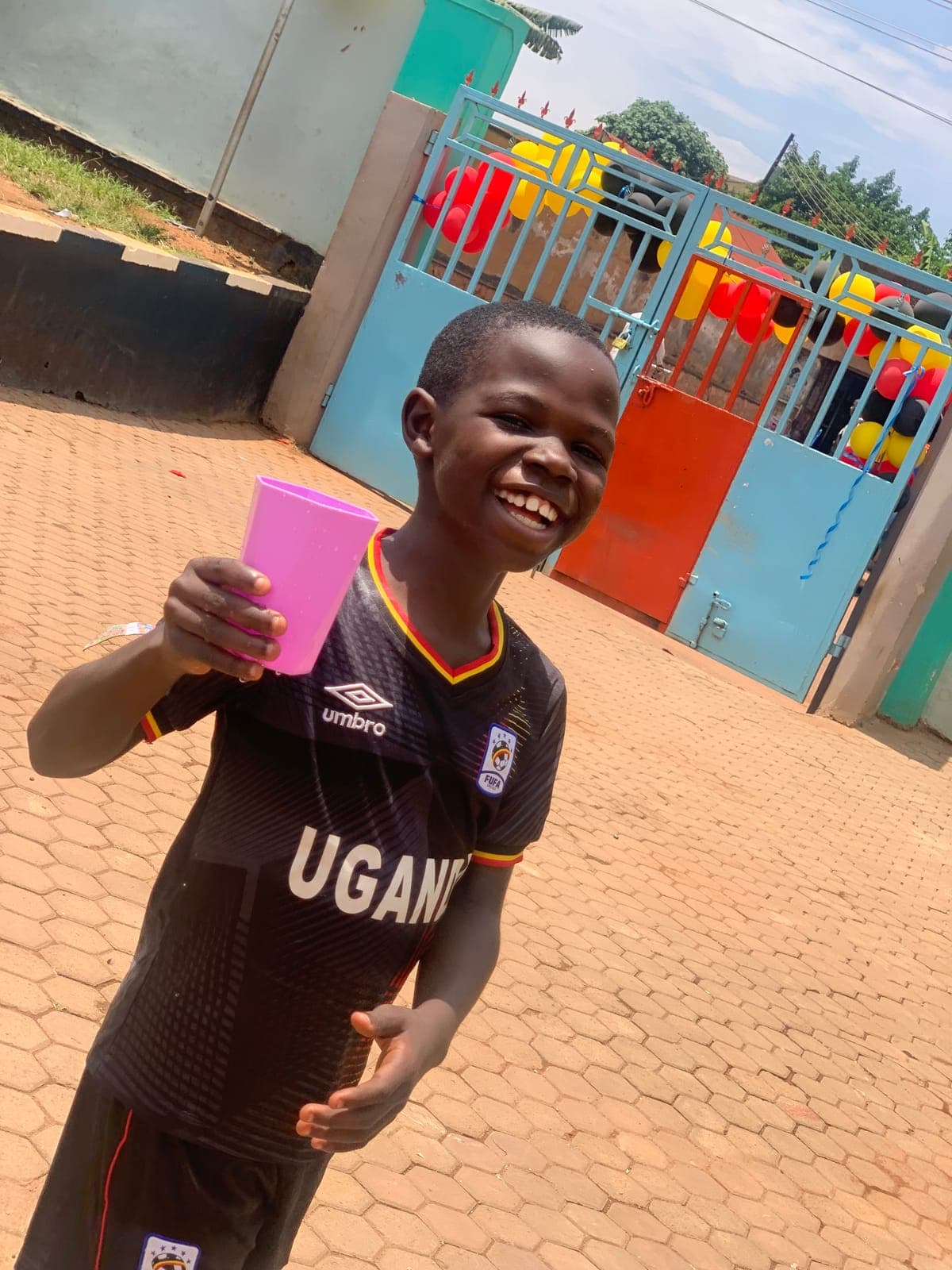 A cold drink at break, by the school gate