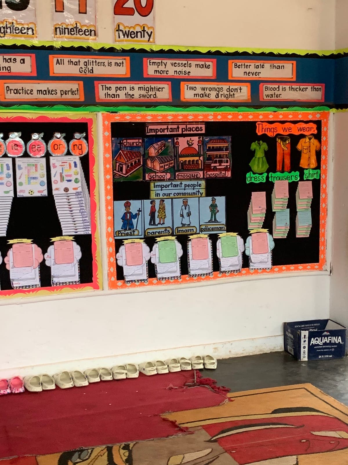 Number charts, proverbs and pupils' own work on the wall