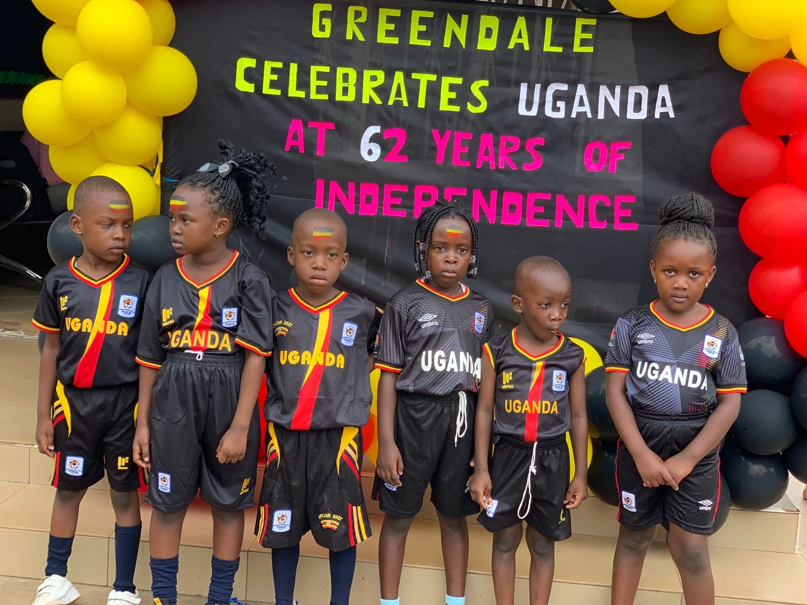 Lined up at the Independence Day banner