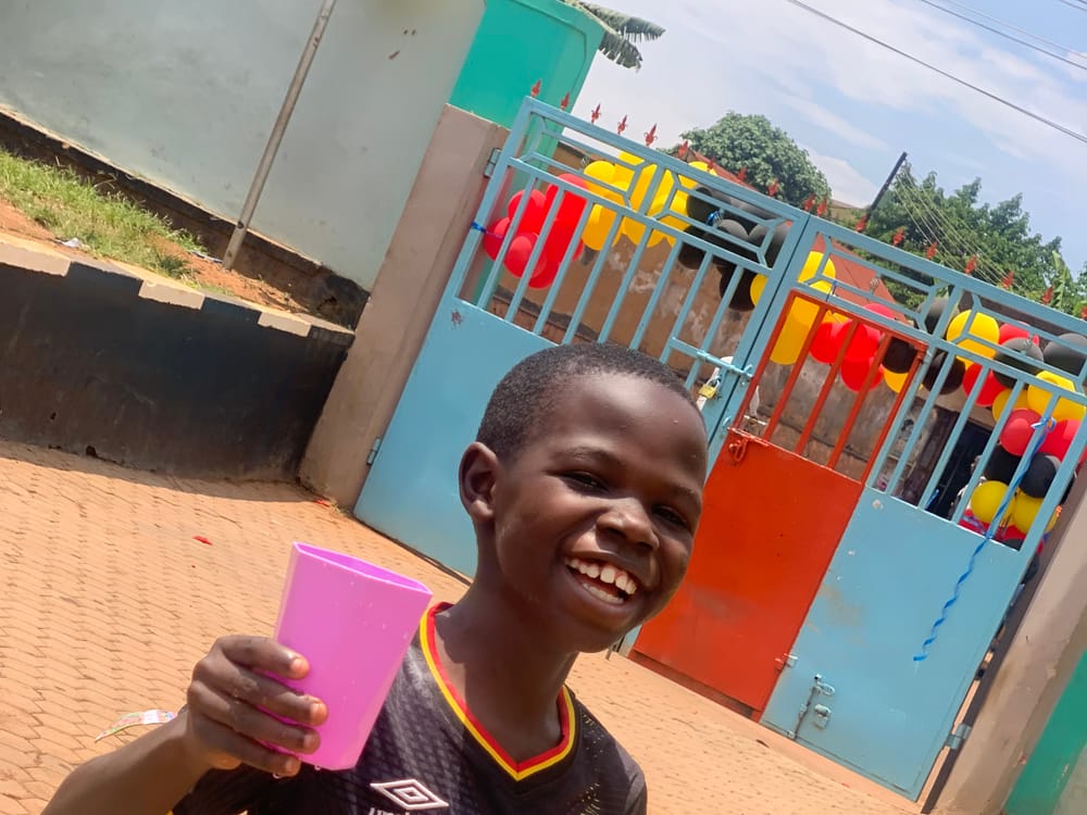 A pupil at break time by the school gate